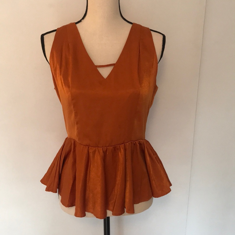 Q&A orange peplum top. LIKE NEW